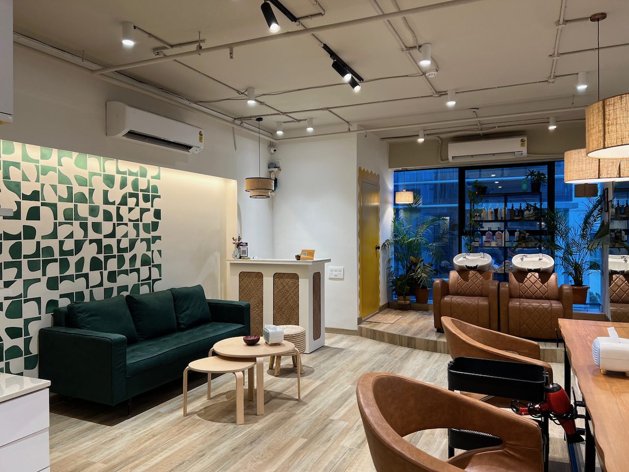 Reception desk beside the green geometric mural